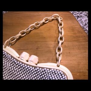 Whiting. And Davis vintage cream Bakelite bag